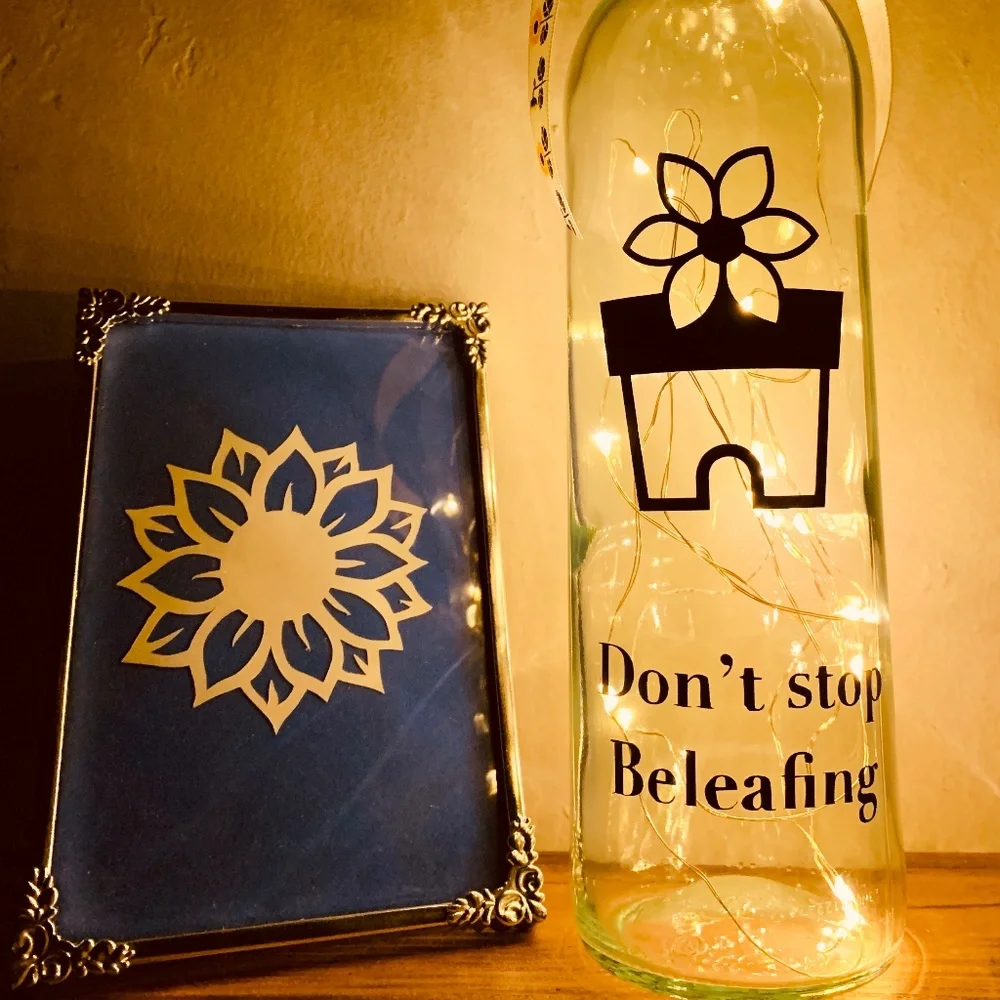 ‘Don’t Stop Beleafing’ logo wine bottle lantern